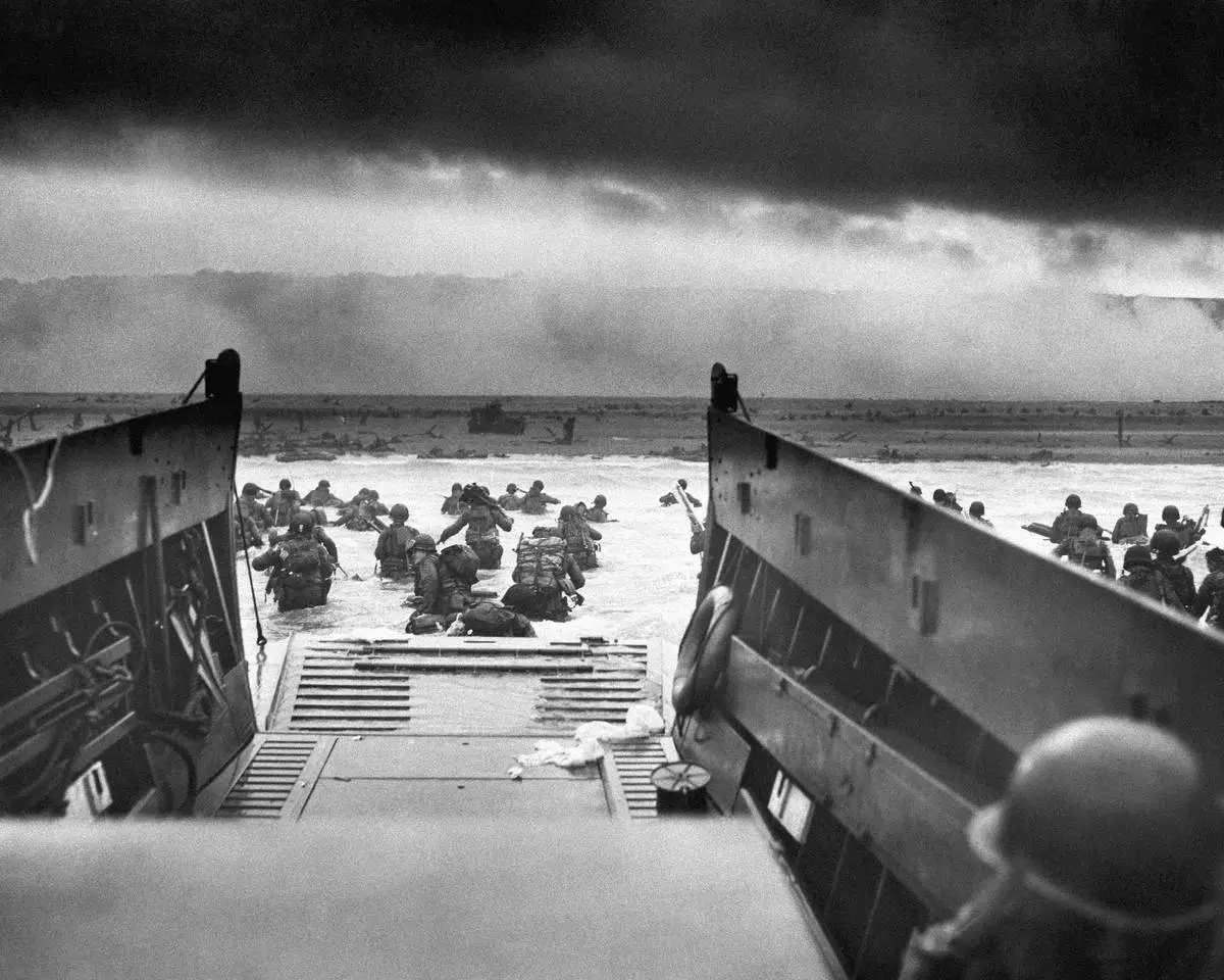 FILE - This photograph is believed to show E Company, 16th Regiment, 1st Infantry Division, participating in the first wave of assaults during D-Day in Normandy, France, June 6, 1944. (Chief Photographer's Mate Robert M. Sargent, U.S. Coast Guard via AP, File)