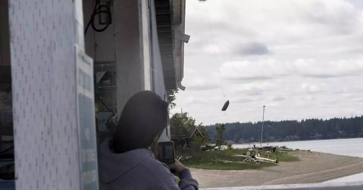 Flying boats make for a rare sight as Washington clears an island of derelict vessels by helicopter