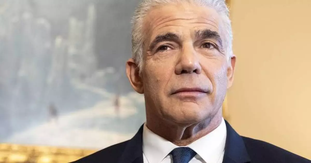 Israeli opposition leader Lapid rallies behind Iran operation, after months of criticizing Netanyahu