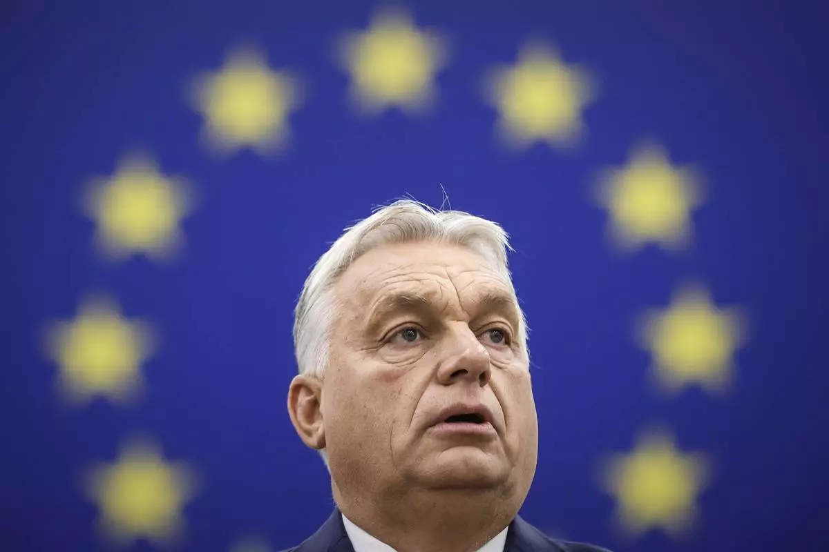 FILE - Hungarian Prime Minister Viktor Orban delivers his speech in the hemicycle of the European parliament in Strasbourg, France, Wednesday, Oct. 9, 2024. (AP Photo/Jean-Francois Badias, File)