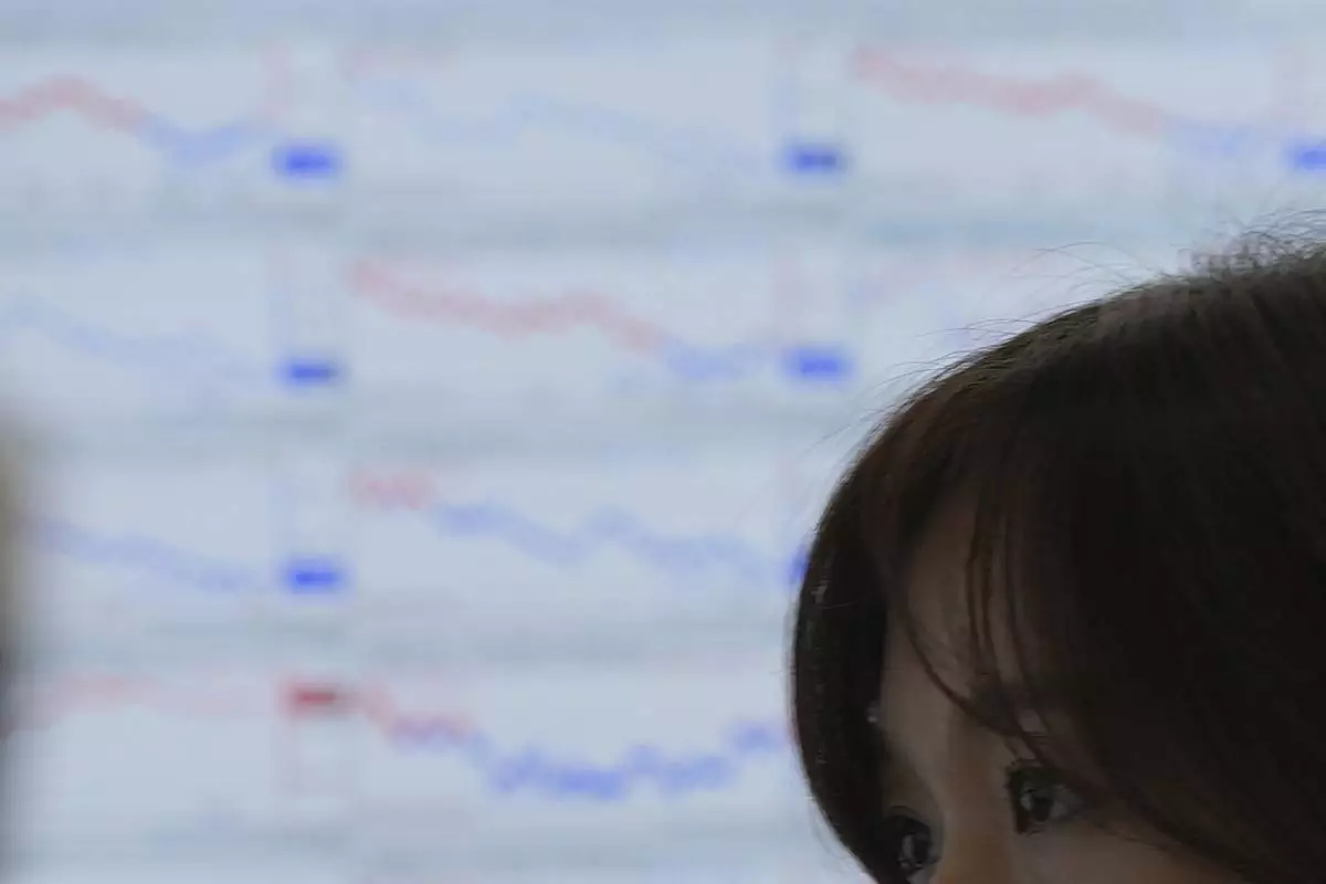 A dealer watches computer monitors at a dealing room of Hana Bank in Seoul, South Korea, Thursday, June 26, 2025. (AP Photo/Lee Jin-man)