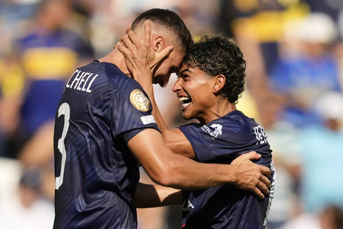 Auckland City's Adam Mitchell, left, and Jerson Lagos celebrate after the Club World Cup Group C soccer match between Auckland City and Boca Juniors in Nashville, Tenn., Tuesday, June 24, 2025. (AP Photo/George Walker IV)
