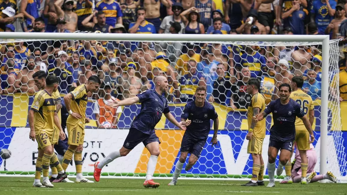 Auckland City's Christian Gray, center left, celebrates after scoring his side's opening goal during the Club World Cup Group C soccer match between Auckland City and Boca Juniors in Nashville, Tenn., Tuesday, June 24, 2025. (AP Photo/George Walker IV)