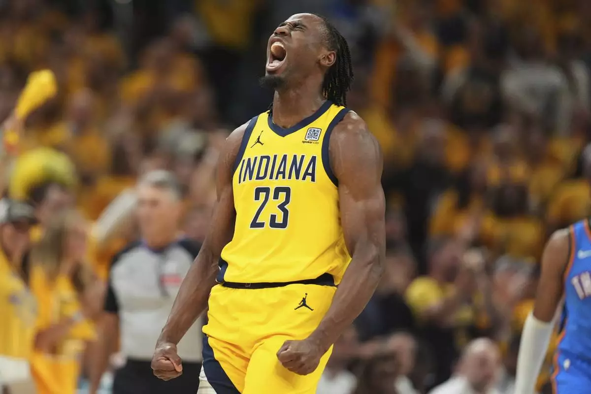Indiana Pacers forward Aaron Nesmith reacts after a basket against the Oklahoma City Thunder during the first half of Game 4 of the NBA Finals basketball series, Friday, June 13, 2025, in Indianapolis. (AP Photo/Michael Conroy)
