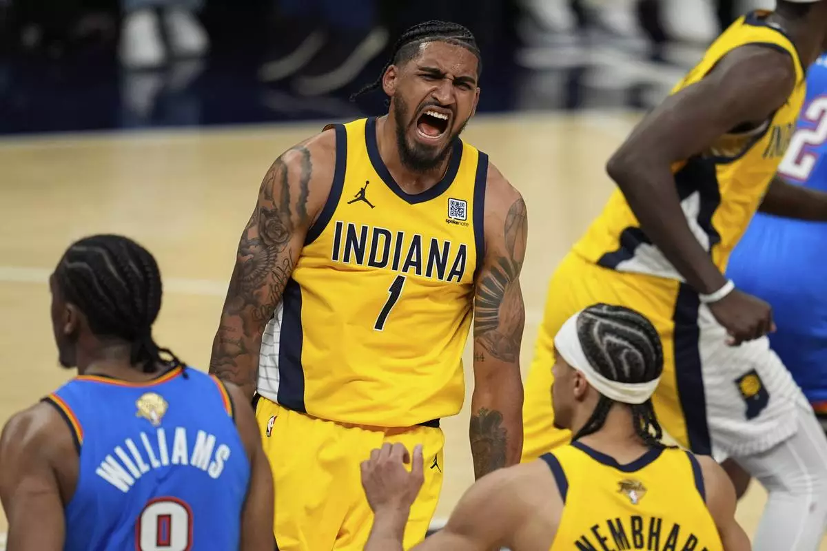 Indiana Pacers forward Obi Toppin (1) celebrates a basket against the Oklahoma City Thunder during the second half of Game 4 of the NBA Finals basketball series, Friday, June 13, 2025, in Indianapolis. (AP Photo/Abbie Parr)