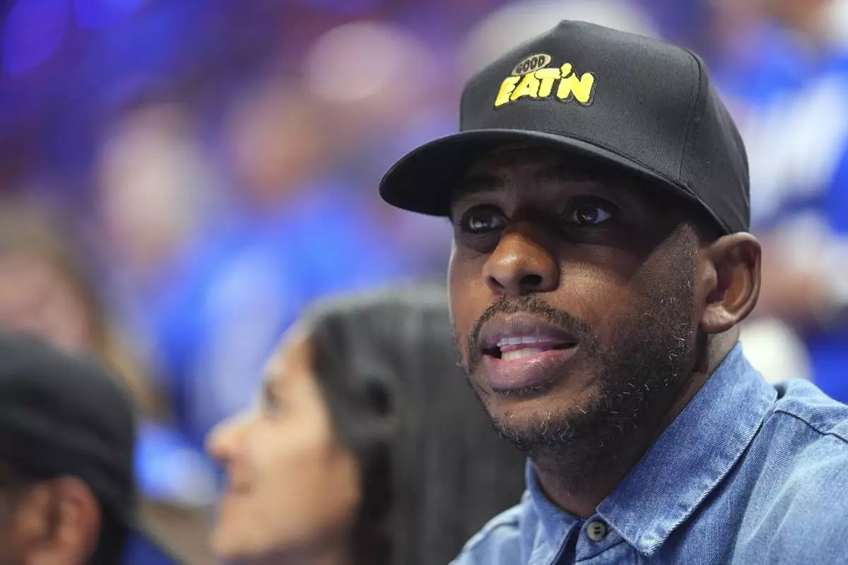 Chris Paul watches the first half of Game 2 of the NBA Finals basketball series between the Indiana Pacers and theOklahoma City Thunder Sunday, June 8, 2025, in Oklahoma City. (AP Photo/Julio Cortez)