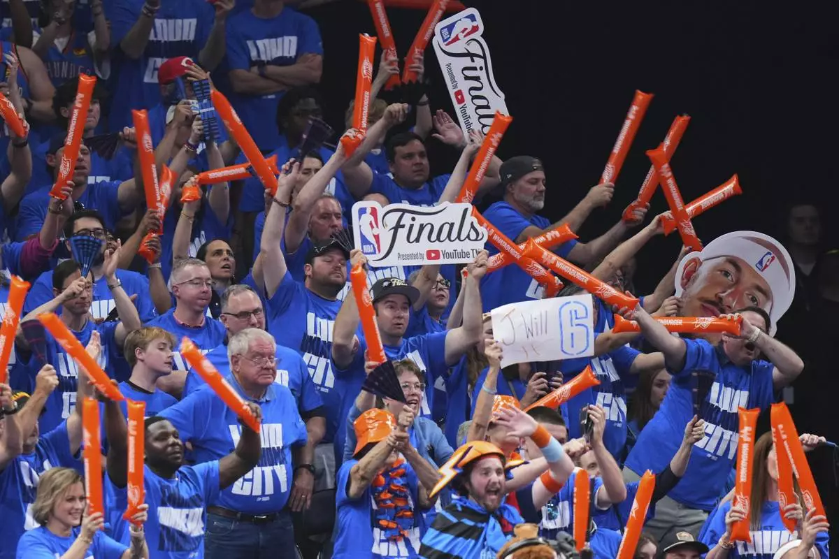 Oklahoma City Thunder fans cheer during the second half of Game 2 of the NBA Finals basketball series against the Indiana Pacers Sunday, June 8, 2025, in Oklahoma City. (AP Photo/Kyle Phillips)