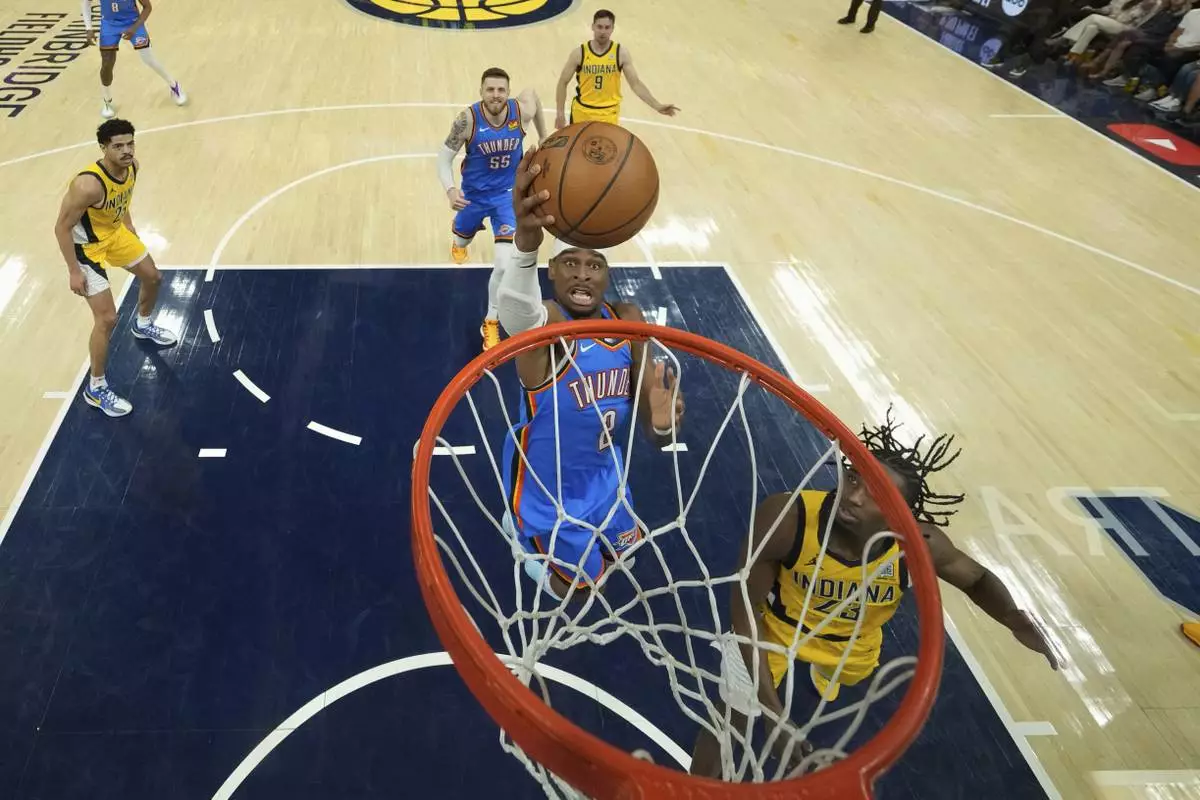 Oklahoma City Thunder forward Jalen Williams (8) shoots over Indiana Pacers forward Aaron Nesmith (23) during the first half of Game 3 of the NBA Finals basketball series, Wednesday, June 11, 2025, in Indianapolis. (AP Photo/Abbie Parr)