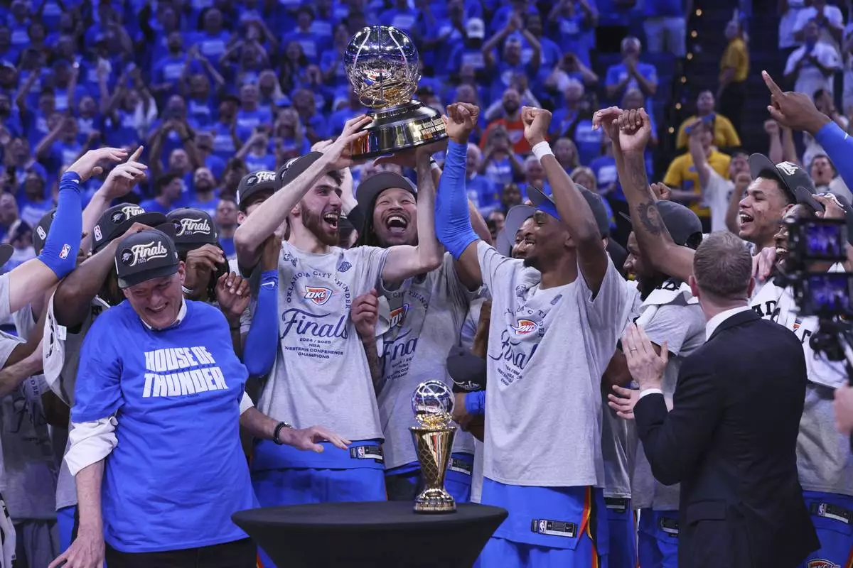 Oklahoma City Thunder players and coaches celebrate after Game 5 of the Western Conference finals of the NBA basketball playoffs against the Minnesota Timberwolves, Wednesday, May 28, 2025, in Oklahoma City. (AP Photo/Nate Billings)
