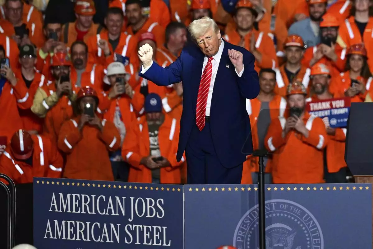 President Donald Trump dances after speaking at the U.S. Steel Mon Valley Works-Irvin plant, Friday, May 30, 2025, in West Mifflin, Pa. (AP Photo/David Dermer)