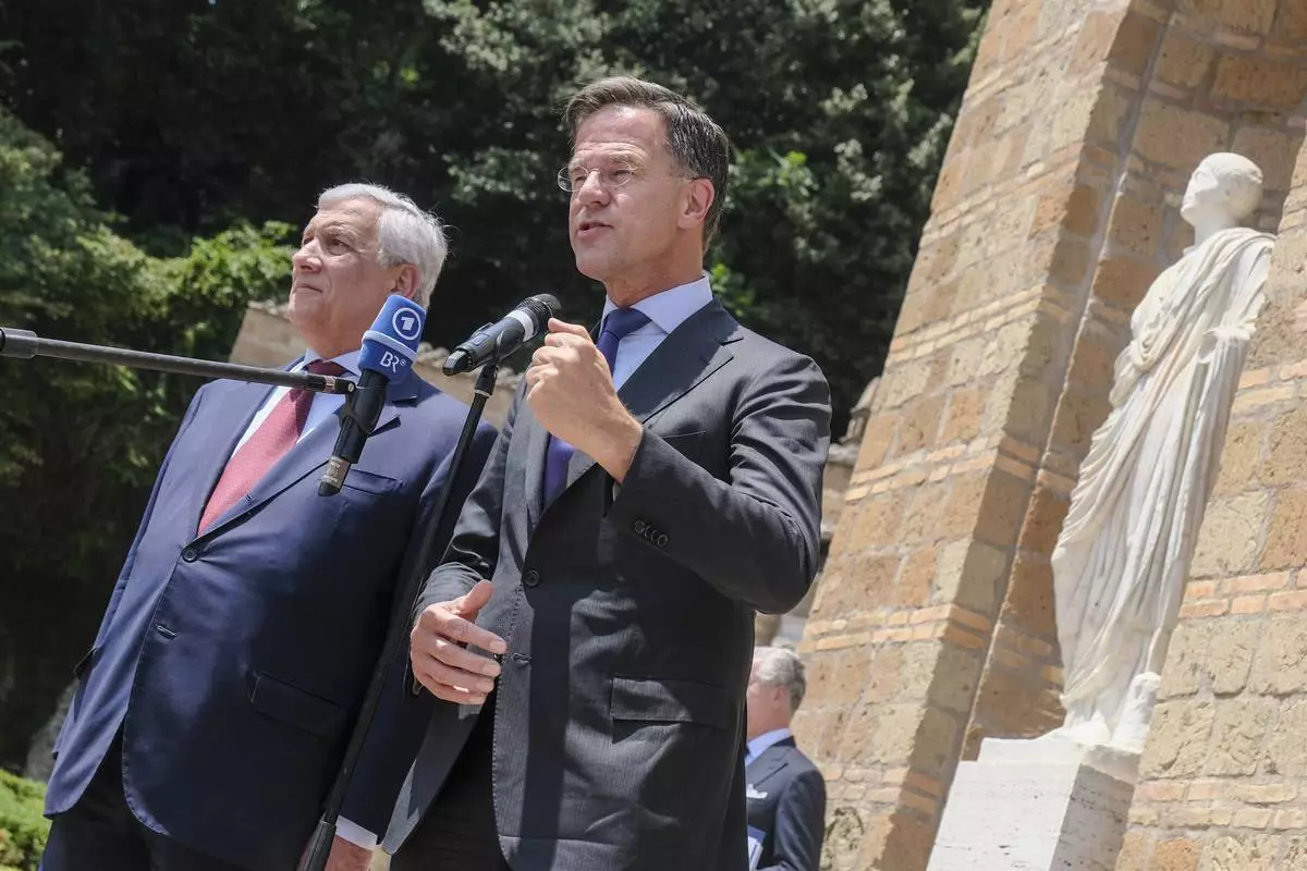 Italy's Foreign Minister Antonio Tajani, left, and Mark Rutte, NATO Secretary General, prior to the "Weimar Plus" Ministerial meeting dedicated to Ukraine and European security in Rome, Italy, Thursday, June 12, 2025. (Mauro Scrobogna/LaPresse via AP)