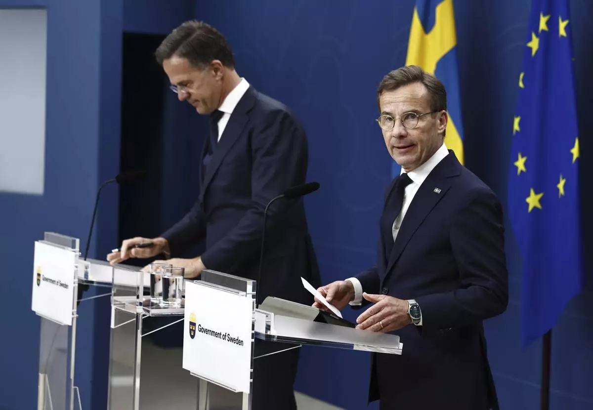 Swedish Prime Minister Ulf Kristersson, right, and NATO Secretary General Mark Rutte hold a joint press conference in Stockholm, Sweden, Friday June 13, 2025. (Stefan Jerrevång/TT News Agency via AP)