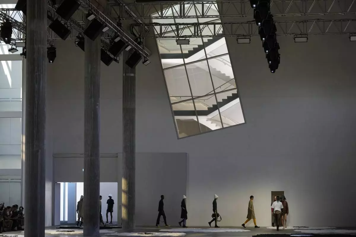 Models wear creations as part of the men's Prada Spring-Summer 2026 collection, that was presented in Milan, Italy, Sunday, June 22, 2025. (AP Photo/Luca Bruno)