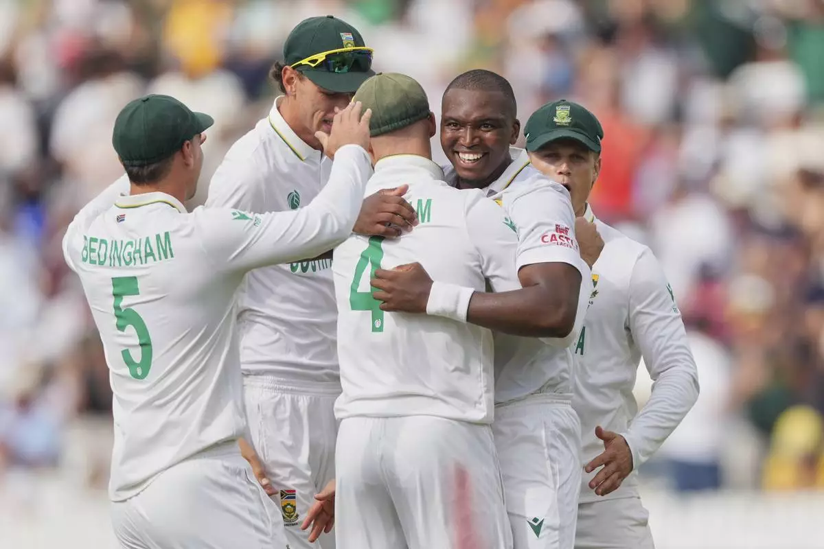 South Africa's Lungi Ngidi, second right, celebrates with teammates the dismissal of Australia's captain Pat Cummins on day two of the World Test Championship final between South Africa and Australia at Lord's cricket ground in London, Thursday, June 12, 2025. (AP Photo/Kirsty Wigglesworth)