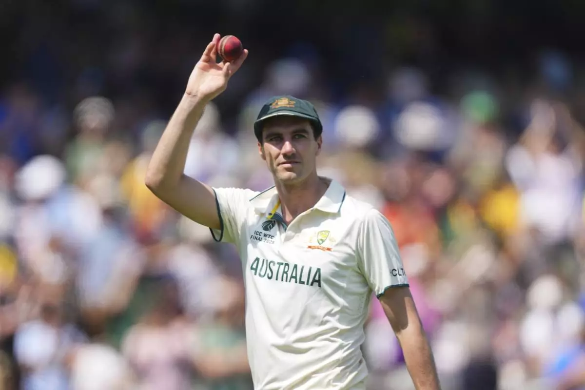 Australia's captain Pat Cummins holds up the ball to celebrate his six-wicket haul on day two of the World Test Championship final between South Africa and Australia at Lord's cricket ground in London, Thursday, June 12, 2025. (AP Photo/Kirsty Wigglesworth)