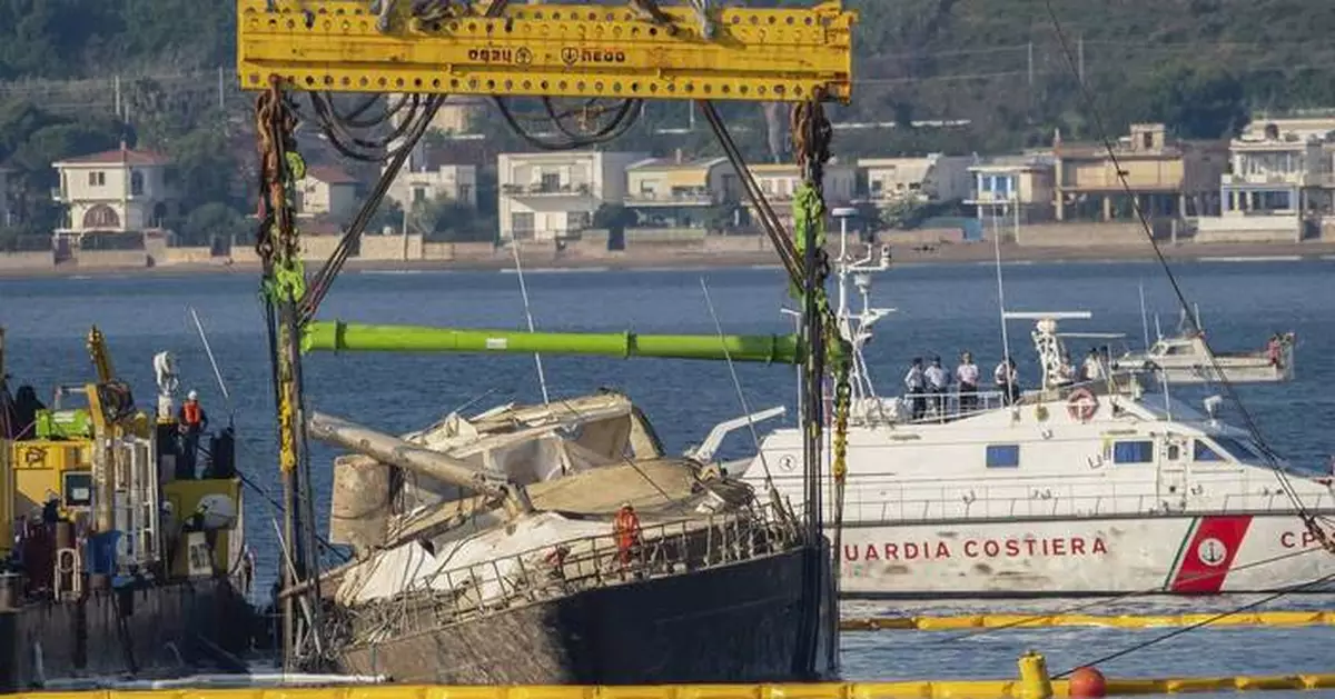 Superyacht is pulled from the depths 10 months after sinking off Sicily