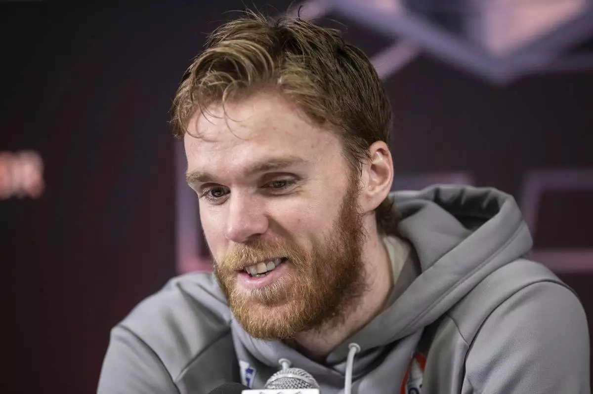 Edmonton Oilers' Connor McDavid (97) speaks to media during a news conference, Tuesday, June 3, 2025, in Edmonton, Alberta, ahead of Game 1 of the NHL hockey Stanley Cup final series against the Florida Panthers. (Jason Franson/The Canadian Press via AP)