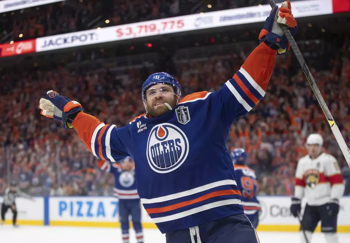 Edmonton Oilers' Leon Draisaitl (29) celebrates his game-winning goal against the Florida Panthers in the first overtime period in Game 1 of the NHL Stanley Cup final in Edmonton, Aberta, Wednesday, June 4, 2025. (Jason Franson/The Canadian Press via AP)