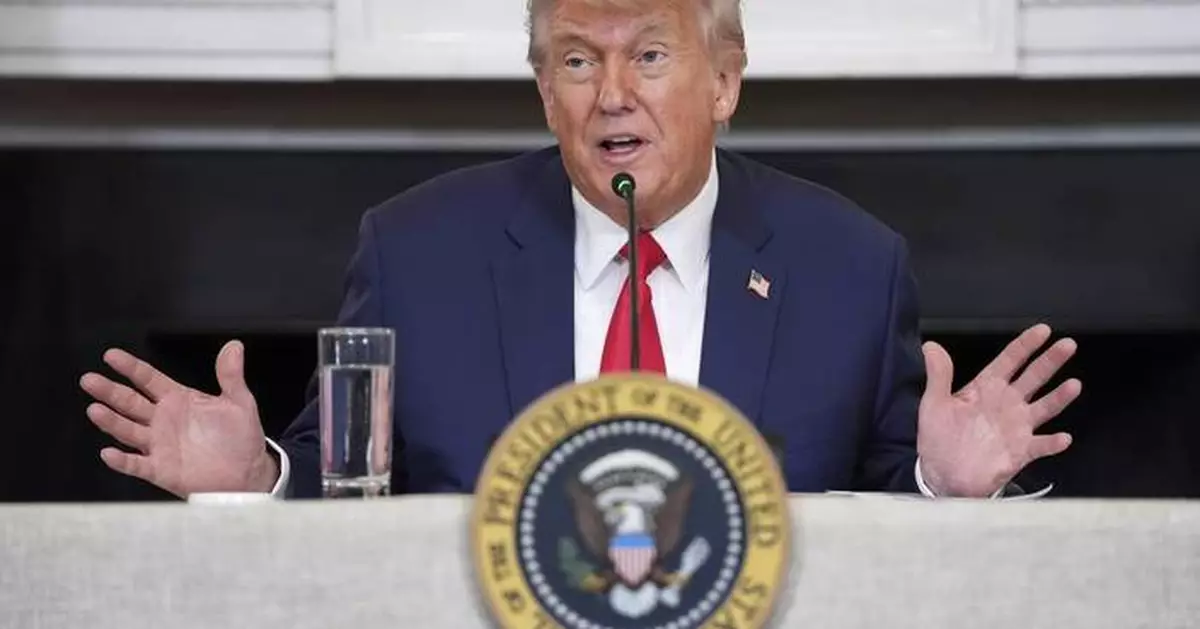 The Latest: Trump pledges to ‘liberate’ LA as he visits troops at Fort Bragg