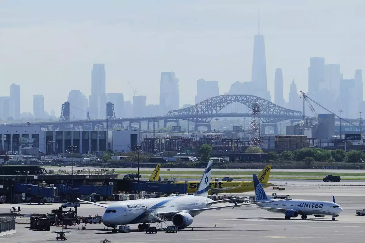 FILE - The New York City skyline is seen behind Newark Liberty International Airport in Newark, N.J., Wednesday, May 7, 2025. (AP Photo/Seth Wenig)