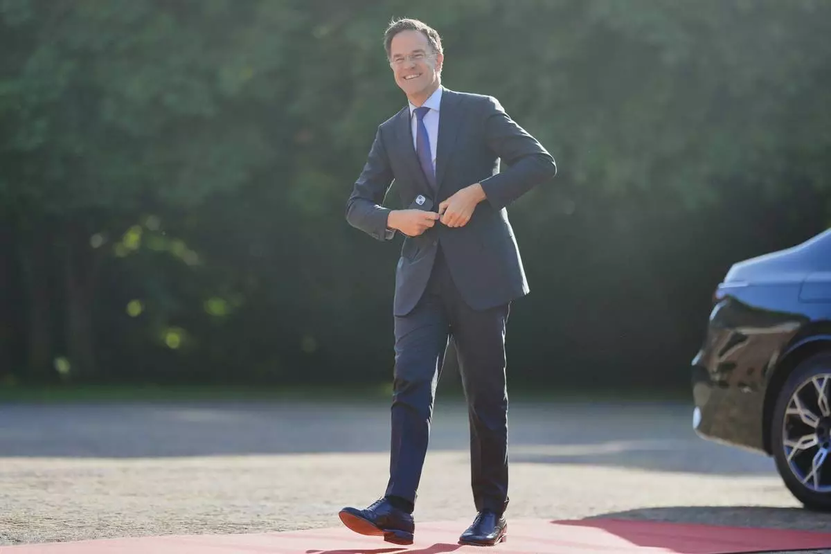 NATO Secretary General Mark Rutte arrives ahead of a formal dinner at the Paleis Huis ten Bosch ahead of the NATO summit in The Hague, Netherlands, Tuesday, June 24, 2025. (AP Photo/Markus Schreiber)
