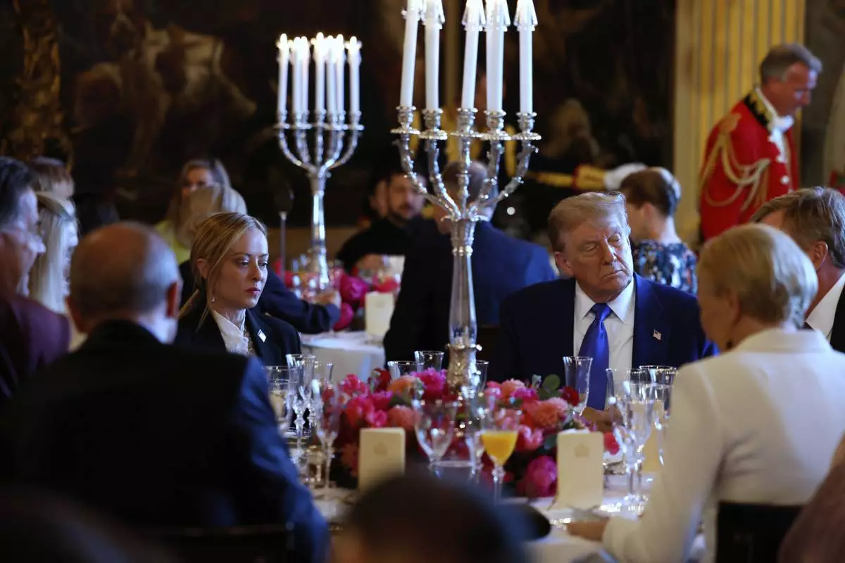 President Donald Trump, center right, and Italy's Prime Minister Giorgia Meloni, center left, attend a dinner for NATO heads of state and government at the Paleis Huis ten Bosch ahead of the NATO summit in The Hague, Netherlands, Tuesday, June 24, 2025. (Remko de Waal, Pool Photo via AP)