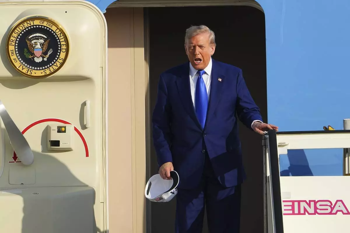 President Donald Trump arrives at Amsterdam Schiphol Airport ahead of the NATO summit, taking place in The Hague, Netherlands, Tuesday, June 24, 2025. (AP Photo/Peter Dejong)