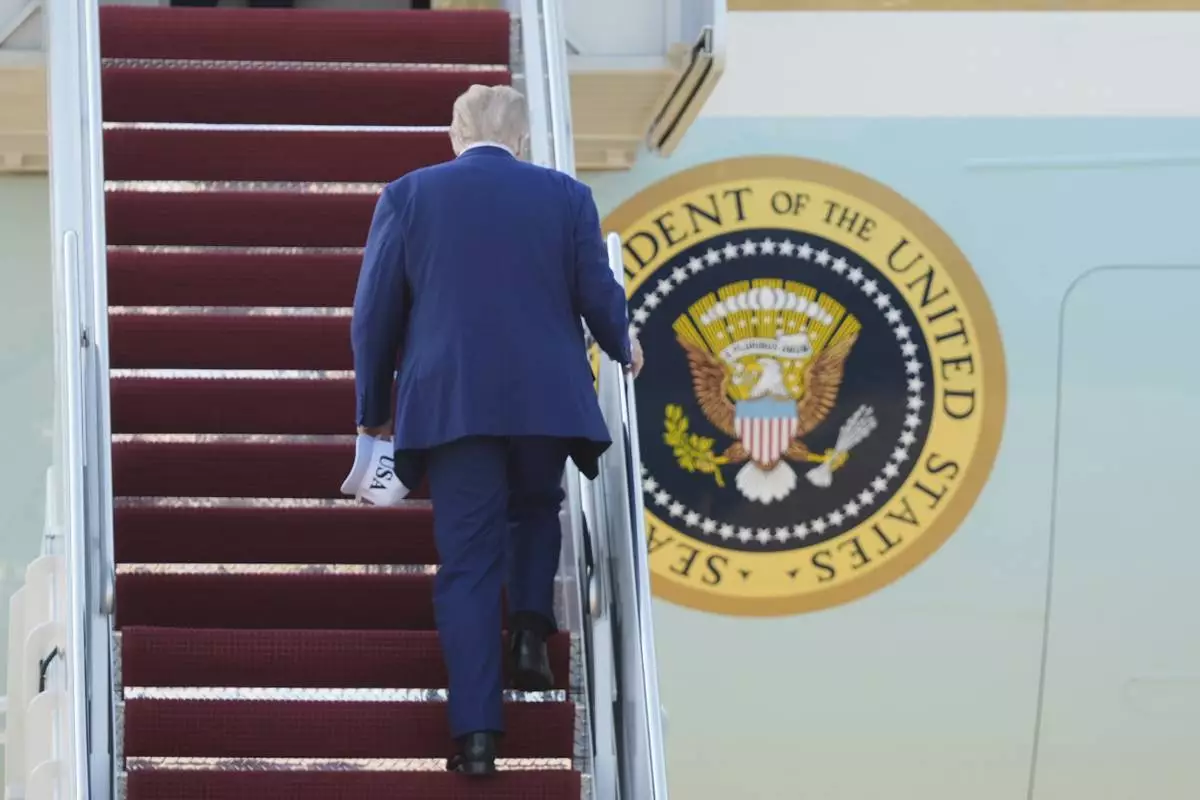 President Donald Trump boards Air Force One, Tuesday, June 24, 2025, at Joint Base Andrews, Md., on his way to The Hague, to join world leaders gathering in the Netherlands for a two-day NATO summit. (AP Photo/Manuel Balce Ceneta)