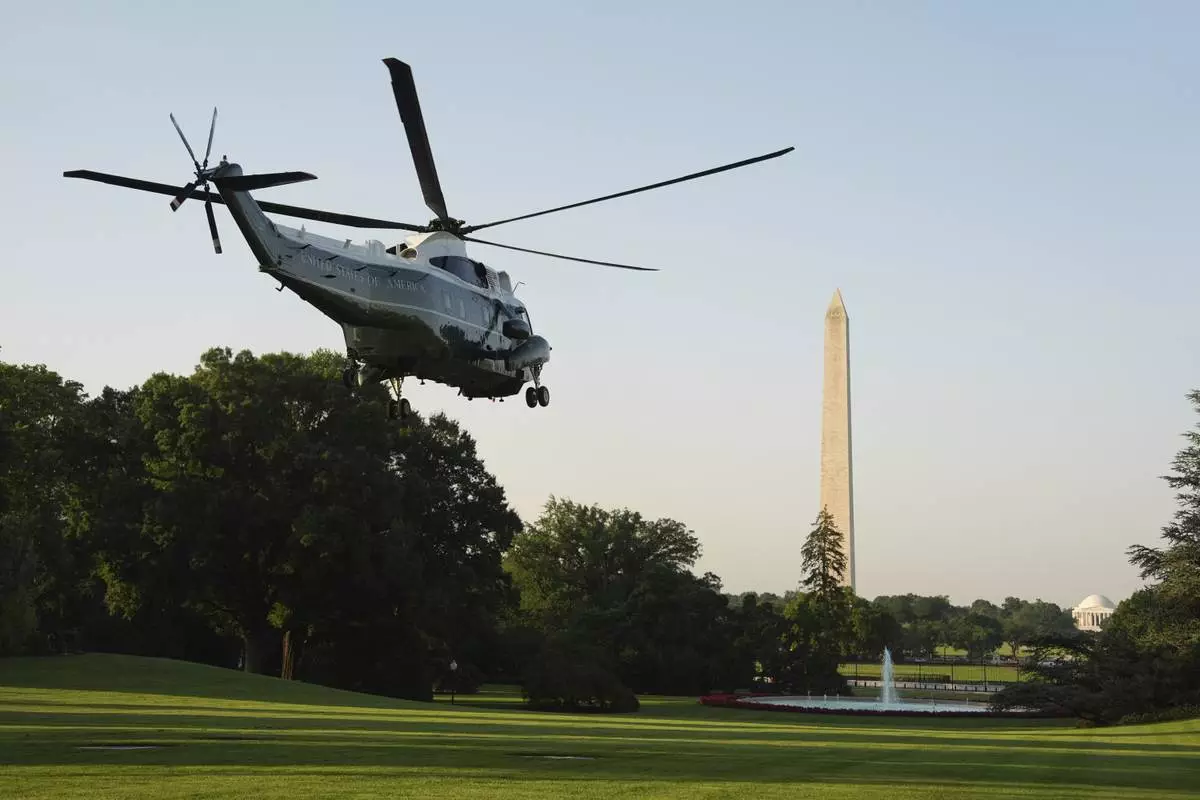 Marine One, with President Donald Trump aboard, lifts off the South Lawn of the White House, Tuesday, June 24, 2025. Trump is on his way to The Hague, to join world leaders gathering in the Netherlands for a two-day NATO summit. The Washington Monument stands right. (AP Photo/Evan Vucci)
