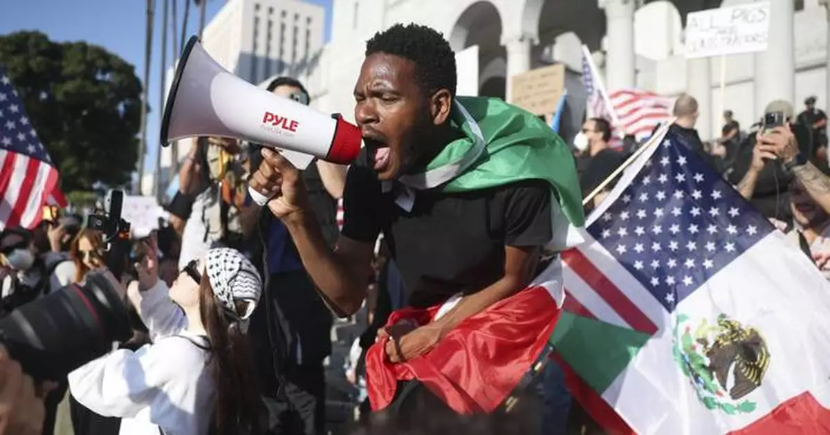 AP PHOTOS: Protests surge across US after Trump mobilizes troops
