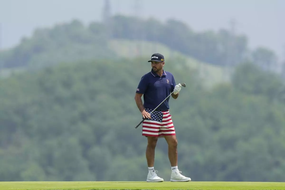 Australian golfer Jason Day, wears U.S. flag-themed shorts as he prepares to putt during a practice round ahead of the U.S. Open golf tournament at Oakmont Country Club Tuesday, June 10, 2025, in Oakmont, Pa. (AP Photo/Charlie Riedel)