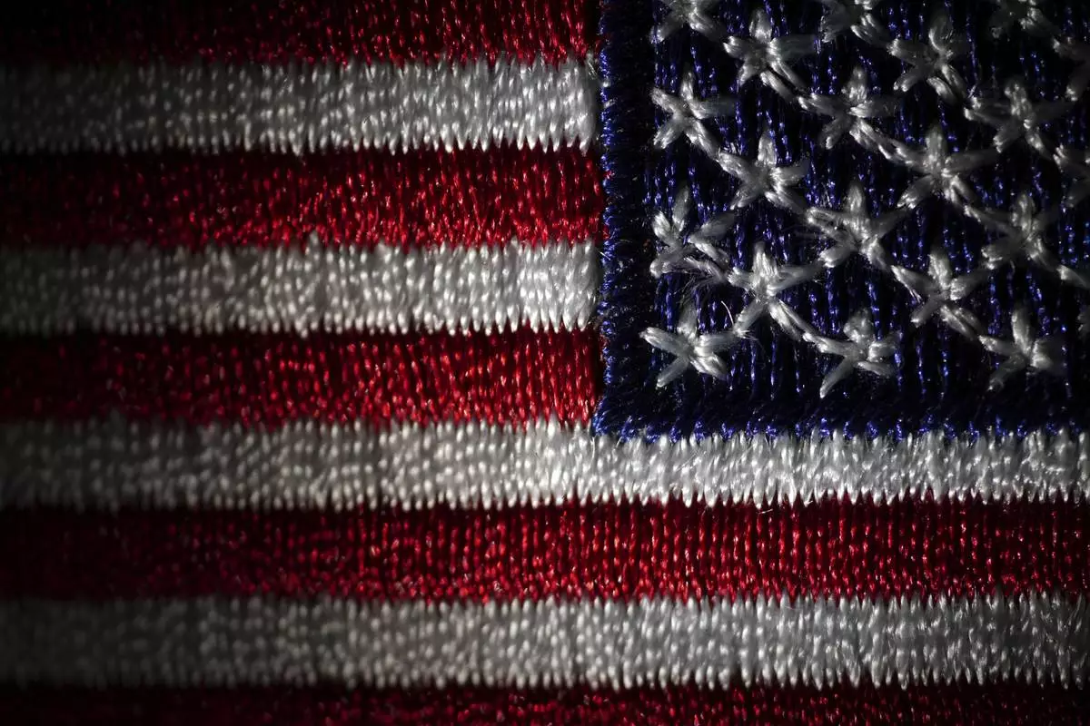 A morale patch embroidered with the United States flag is seen, Friday, June 6, 2025, in Marple Township, Pa. (AP Photo/Matt Slocum)