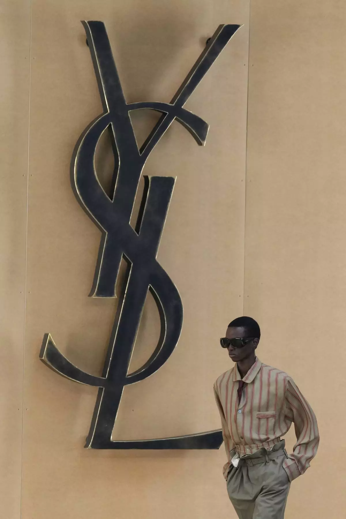 A model wears a creation as part of the men's Saint Laurent Spring-Summer 2026 collection, that was presented in Paris, Tuesday, June 24, 2025. (AP Photo/Michel Euler)