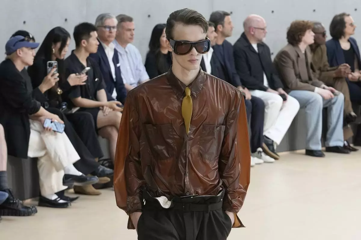 A model wears a creation as part of the men's Saint Laurent Spring-Summer 2026 collection, that was presented in Paris, Tuesday, June 24, 2025. (AP Photo/Michel Euler)