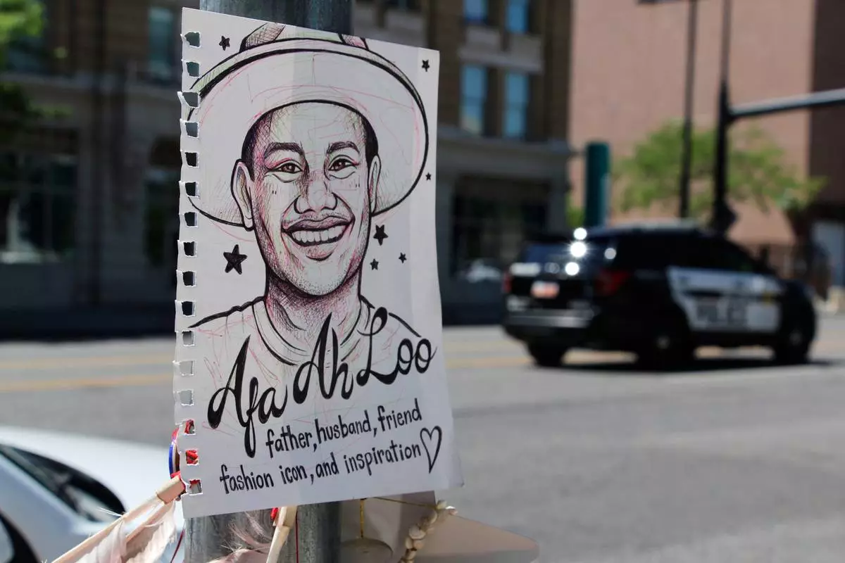 A makeshift memorial for Arthur Folasa Ah Loo, known to friends and family as Afa, is seen Tuesday, June 17, 2025, in downtown Salt Lake City, on the block where Ah Loo was fatally shot during a "No Kings" protest on Saturday, June 14. (AP Photo/Hannah Schoenbaum)