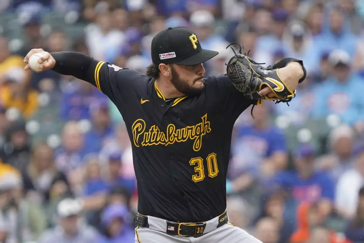 Pittsburgh Pirates pitcher Paul Skenes (30) throws during the first inning of a baseball game against the Chicago Cubs, Friday, June 13, 2025, in Chicago. (AP Photo/David Banks)