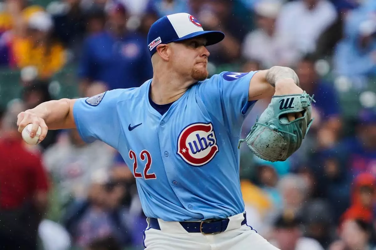 Chicago Cubs pitcher Cade Horton (22) throws during the first inning of a baseball game against the Pittsburgh Pirates, Friday, June 13, 2025, in Chicago. (AP Photo/David Banks)