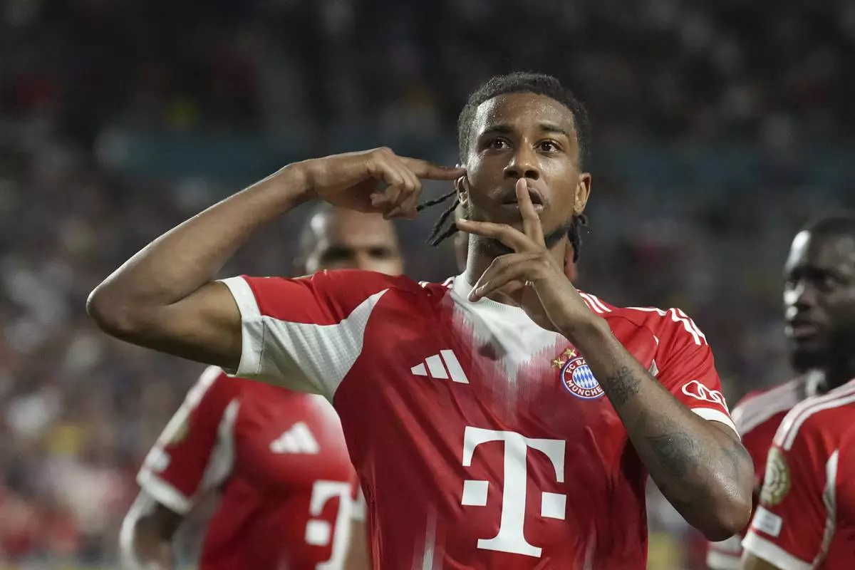 Bayern Munich's Michael Olise celebrates scoring his side's 2nd goal during the Club World Cup Group C soccer match between Bayern Munich and Boca Juniors in Miami Gardens, Fla., Friday, June 20, 2025. (AP Photo/Rebecca Blackwell)