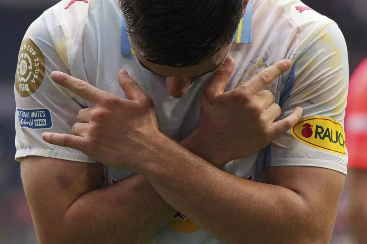Red Bull Salzburg's Oscar Gloukh celebrates after scoring his side's opening goal during the Club World Cup group H soccer match between CF Pachuca and FC Salzburg in Cincinnati, Wednesday, June 18, 2025. (AP Photo/Jeffrey Dean)
