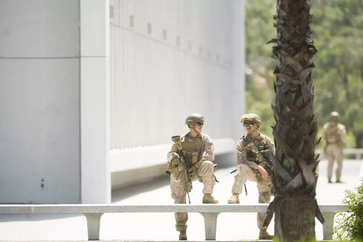 U.S Marines guard a federal building, Friday, June 13, 2025, in Los Angeles (AP Photo/Noah Berger)