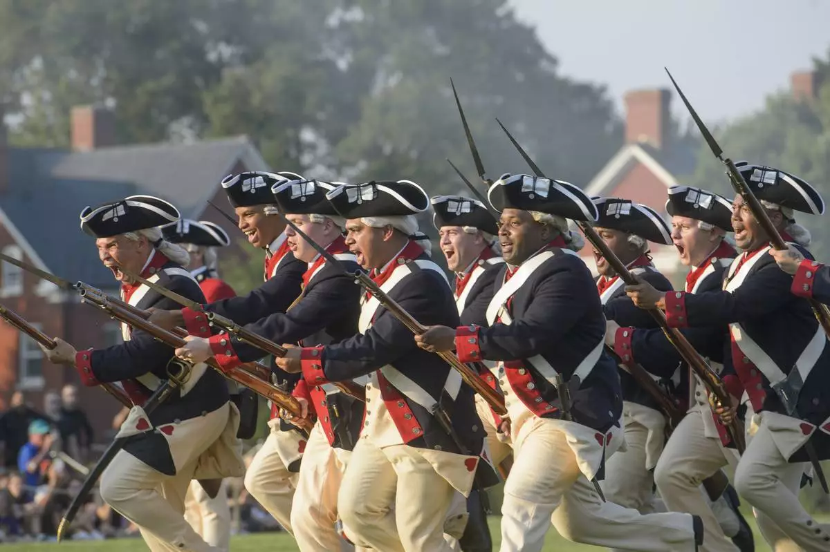 U.S. Army soldiers hold a performance as Washington's Continental Army during the Army Birthday Twilight Tattoo event at Joint Base Myer-Henderson Hall, Wednesday, June 11, 2025, in Fort Myer, Va. (AP Photo/Rod Lamkey, Jr.)