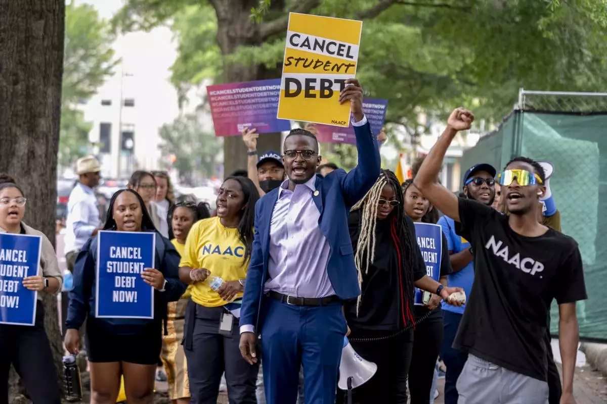 FILE - People demonstrate in Lafayette Park across from the White House in Washington, June 30, 2023, after a sharply divided Supreme Court has ruled that the Biden administration overstepped its authority in trying to cancel or reduce student loan debts for millions of Americans. (AP Photo/Andrew Harnik, File)