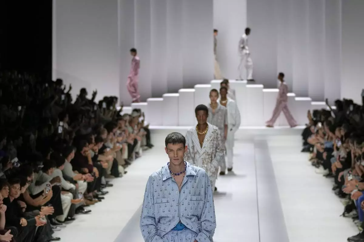 Models wear creations as part of the men's Dolce &amp; Gabbana Spring-Summer 2026 collection, that was presented in Milan, Italy, Saturday, June 21, 2025. (AP Photo/Luca Bruno)