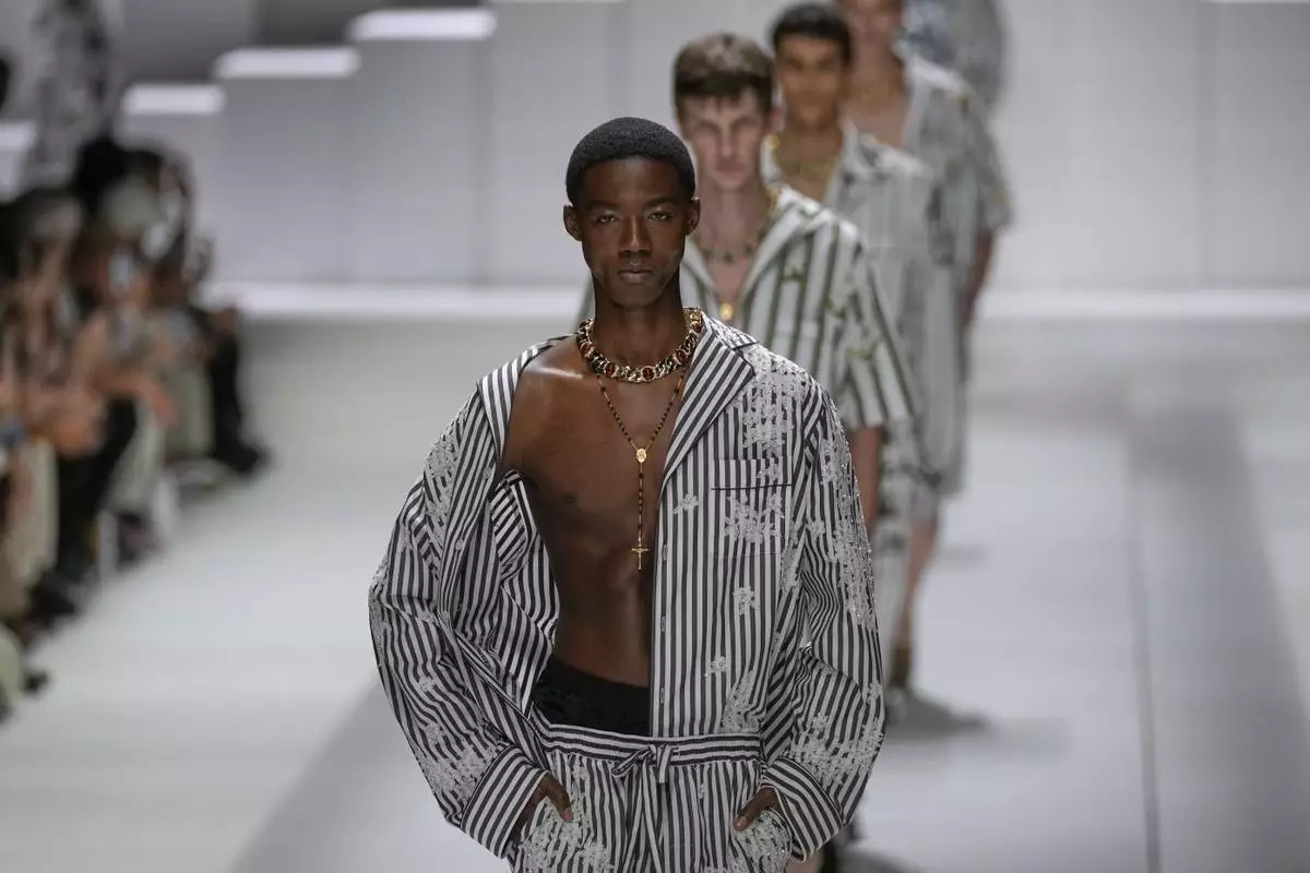 Models wear creations as part of the men's Dolce &amp; Gabbana Spring-Summer 2026 collection, that was presented in Milan, Italy, Saturday, June 21, 2025. (AP Photo/Luca Bruno)