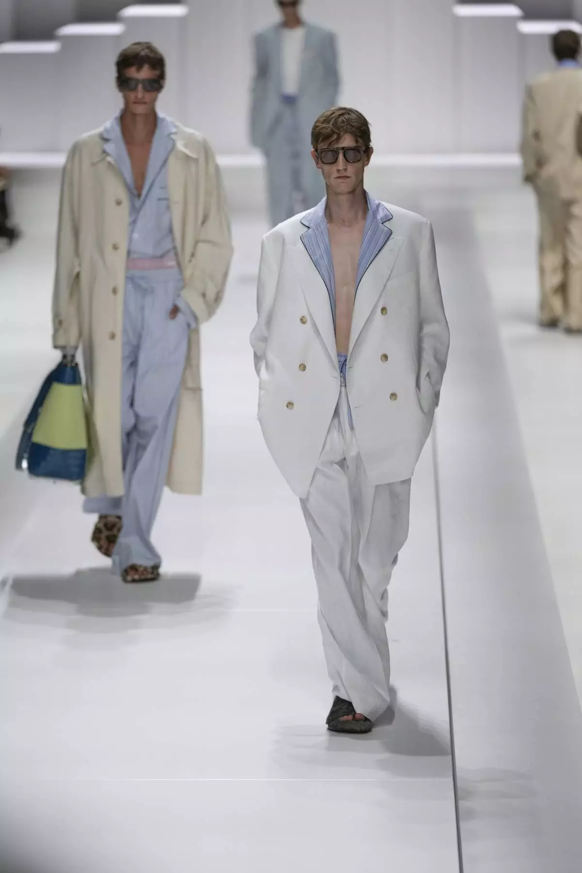 Models wear creations as part of the men's Dolce &amp; Gabbana Spring-Summer 2026 collection, that was presented in Milan, Italy, Saturday, June 21, 2025. (AP Photo/Luca Bruno)