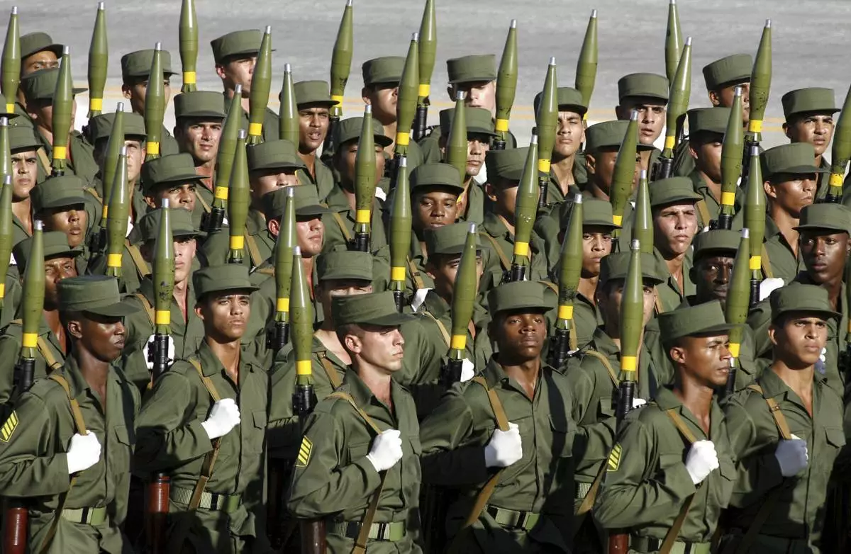 FILE - Cuban soldiers march during a military parade along the Revolution Square in Havana, Cuba, Dec. 2, 2006. (AP Photo/ Javier Galeano, File)