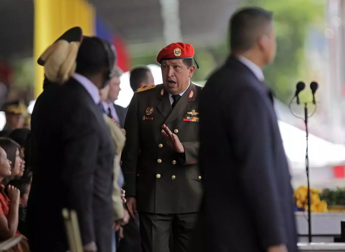 FILE - Venezuela's President Hugo Chavez salutes as he arrives to preside over a civilian-military parade part of Venezuela's 200th independence anniversary celebrations in Caracas, April 19, 2010.(AP Photo/Ariana Cubillos, File)