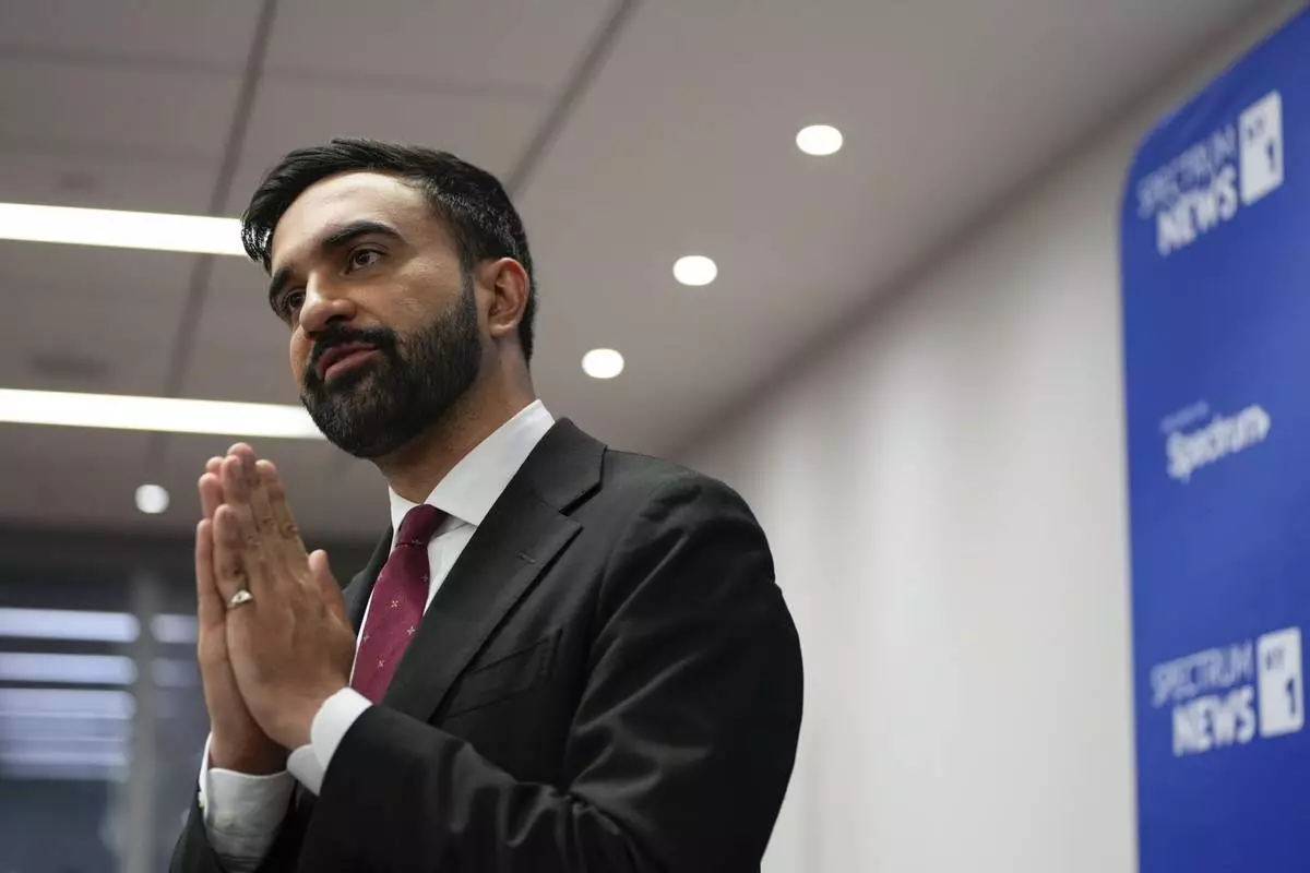 Assemblyman Zohran Mamdani talks to people after the New York City Democratic Mayoral Primary Debate at the John Jay College of Criminal Justice in the Gerald W. Lynch Theater on Thursday, June 12, 2025 in New York City. (Vincent Alban/The New York Times via AP, Pool)