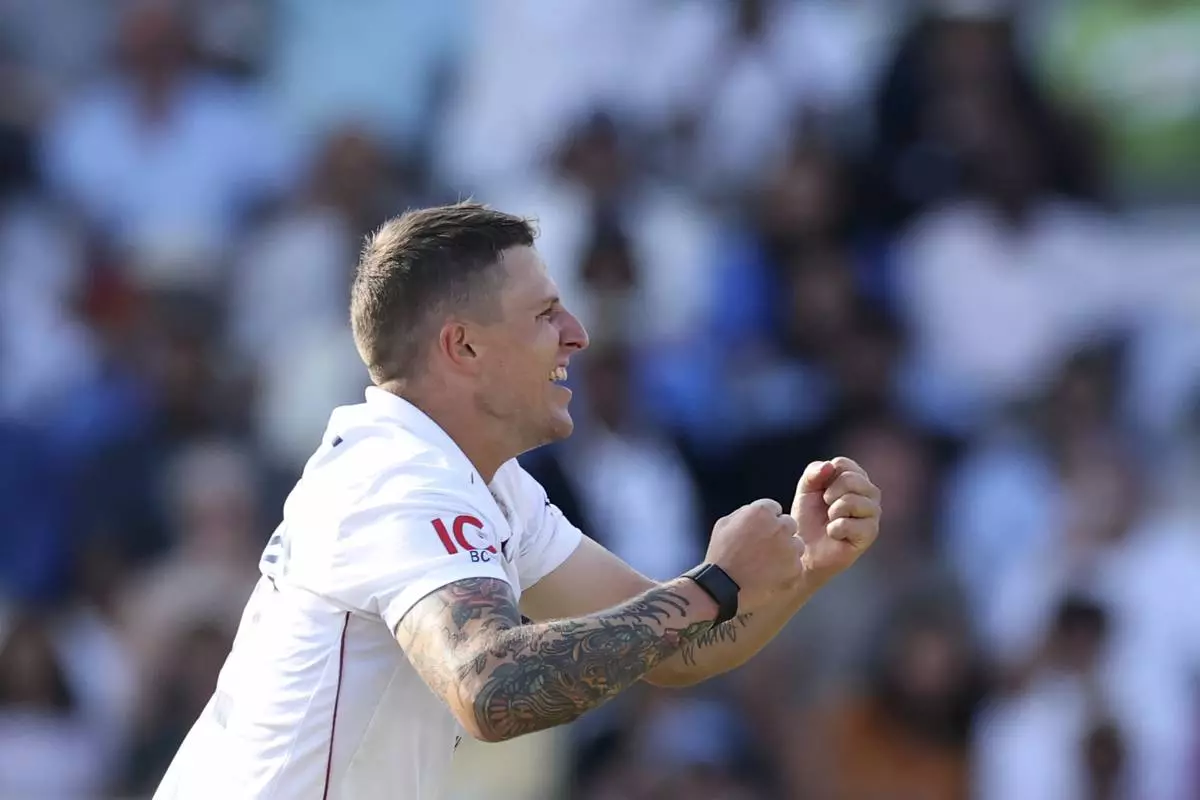 England's Brydon Carse celebrates the dismissal of India's Karun Nair during the fourth day of the third cricket test match between England and India at Lord's cricket ground in London, Sunday, July 13, 2025.(AP Photo/Richard Pelham)