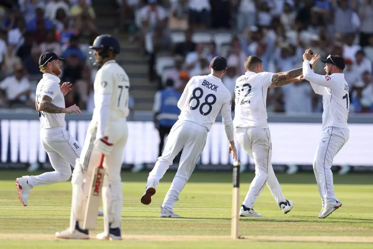 England's Brydon Carse, second right, celebrates with teammates after the dismissal of India's captain Shubman Gill, second left, during the fourth day of the third cricket test match between England and India at Lord's cricket ground in London, Sunday, July 13, 2025.(AP Photo/Richard Pelham)